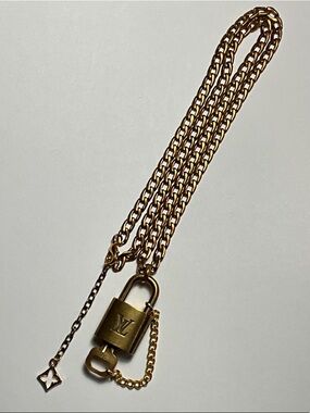 Authentic Brass Louie Vuitton Padlock and Key #301 put on a chain